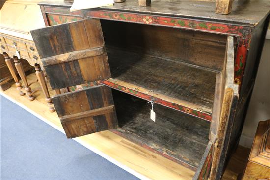 An Eastern painted and decorated pine cabinet W.127cm